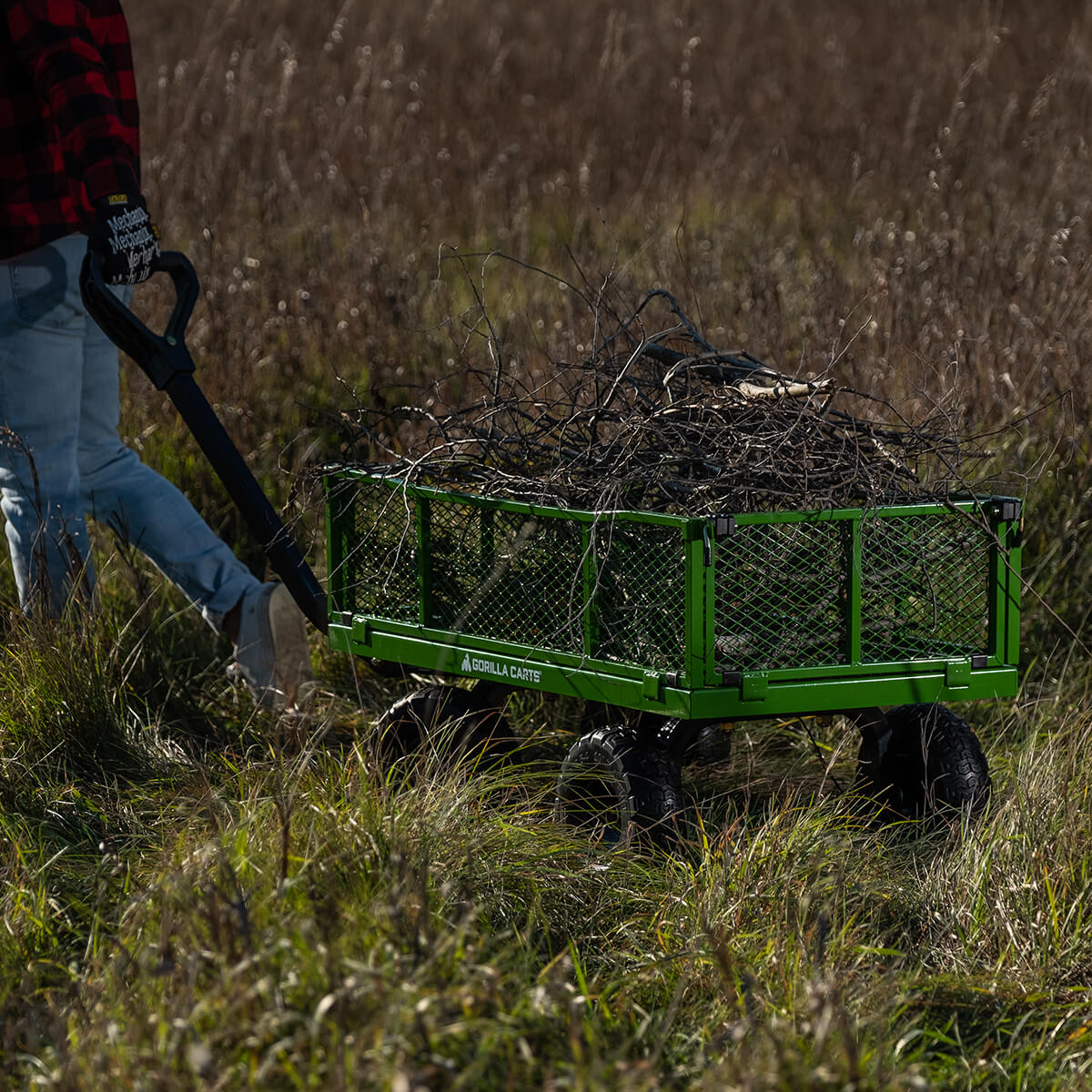 man pulling 2140GCG-NF filled with branches