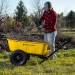 Man placing branches in a GCPT-8-C